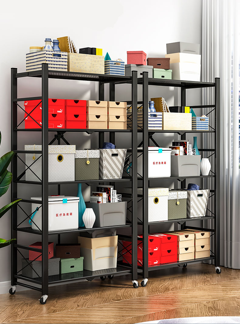 Black foldable rack in a bedroom used for clothing storage and folded linen