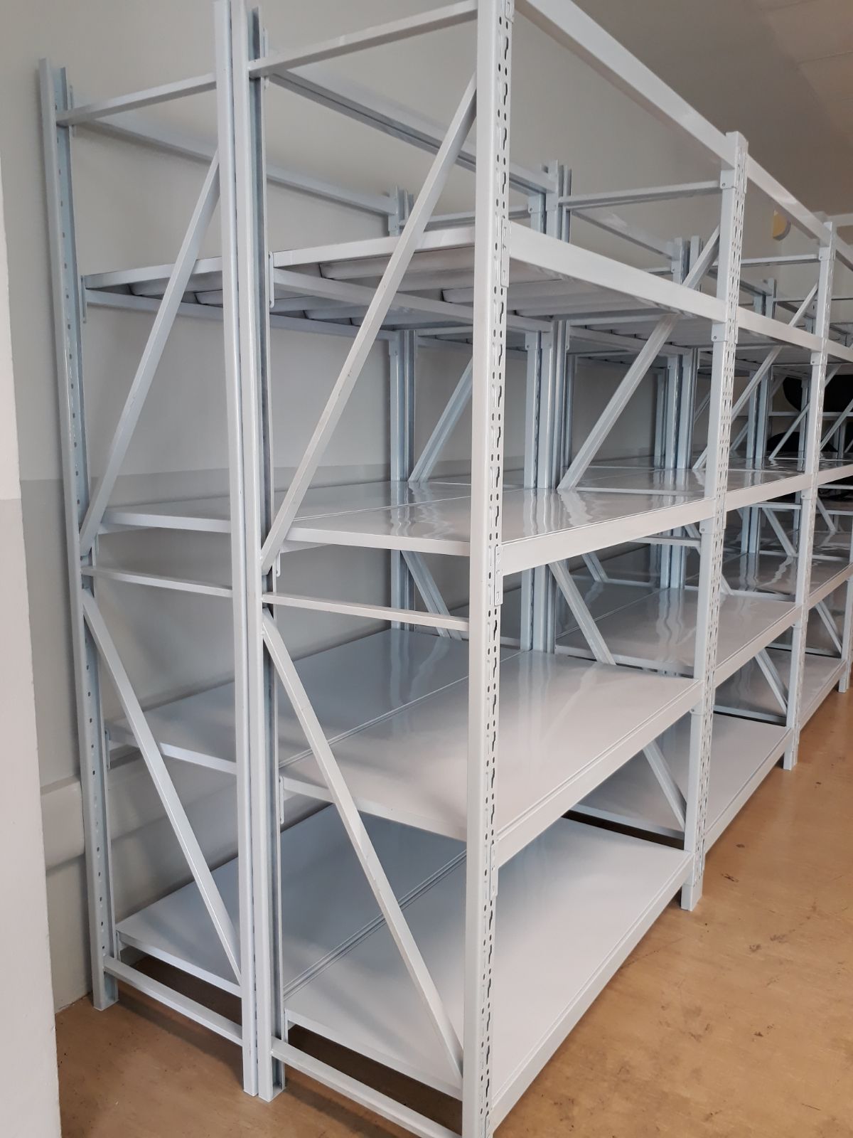 Boltless powder-coated steel storage rack with four adjustable shelves, the system every line in the range is built from