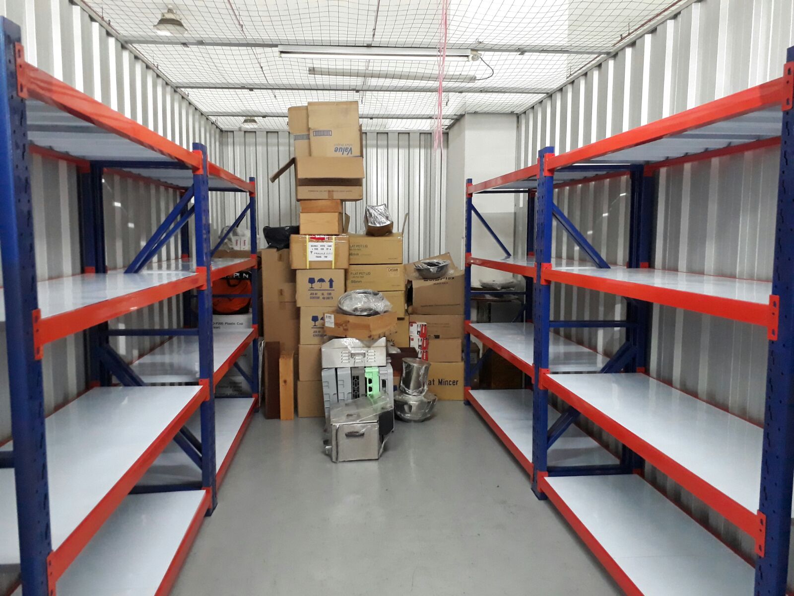 Heavy duty boltless racking installed along the wall of a Singapore storage facility
